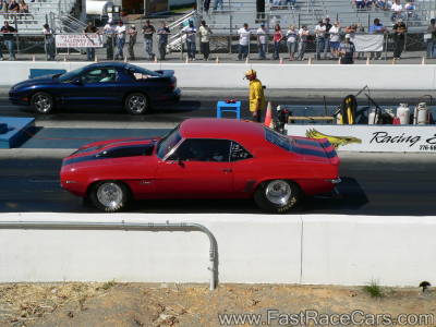 RED 1969 CAMARO WITH BLACK STRIPES